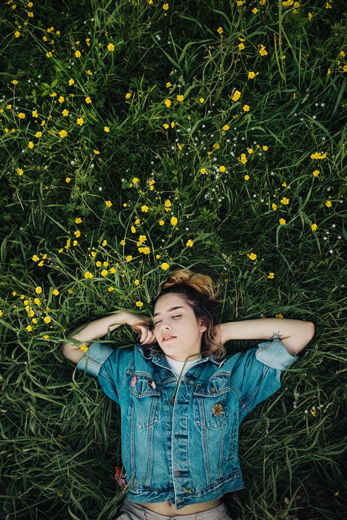 woman asleep in grass outside