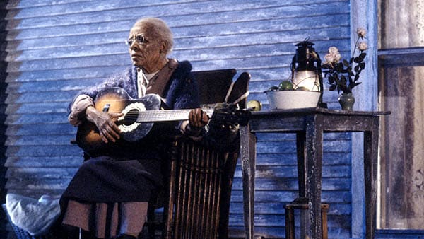 the stand (1994) miniseries mother abagail playing her guitar on the porch