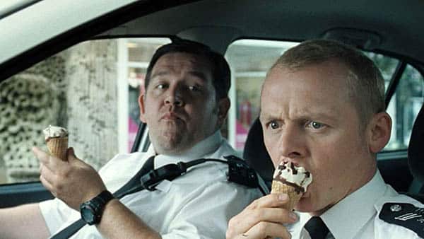 hot fuzz - simon pegg and nick frost eat icecream in their patrol car - best buddy cop movies ever