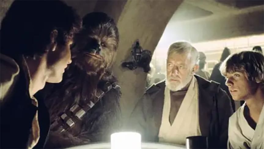 Obi-Wan Kenobi and Luke Skywalker negotiate the trip to Alderaan with Han and Chewie in the Mos Eisley cantina.