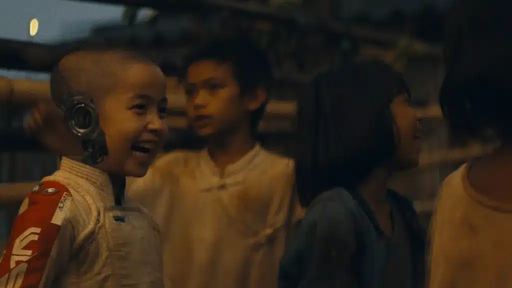 A scene from The Creator showing an artificial intelligence child or AI beings amid human conflict.