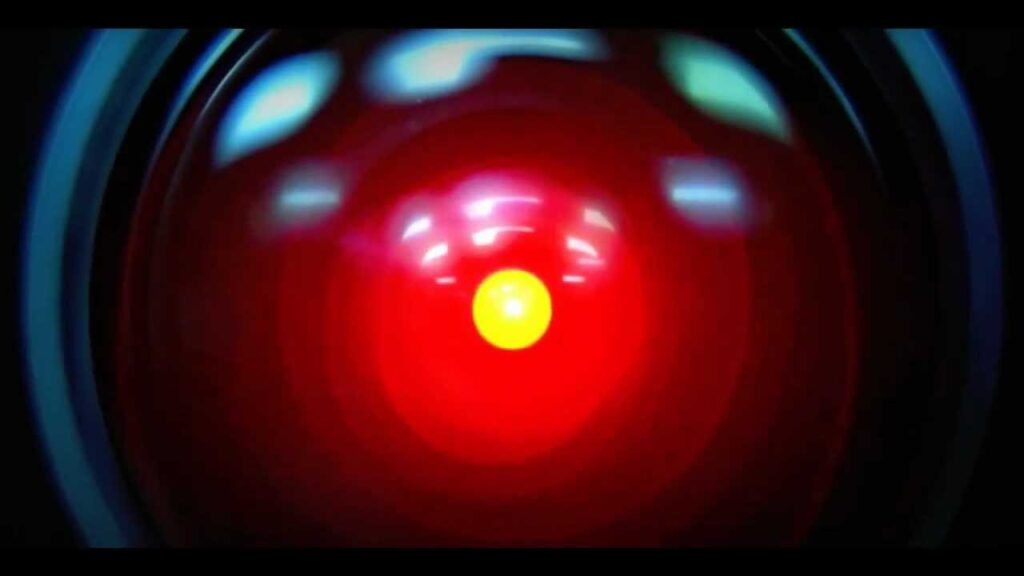 Close-up of HAL 9000’s red camera eye from 2001: A Space Odyssey. One of the first pessimistic, but ultimately threat averted, examples of AI doom or p(doom).